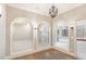 Arched hallway with views through doorways, showcasing the open and airy layout of the home at 164 Arabella Ct, Cary, NC 27518