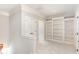 Hallway with built in display niche with shelves and white trim at 164 Arabella Ct, Cary, NC 27518