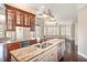 Spacious kitchen island with granite countertops and stainless steel appliances at 164 Arabella Ct, Cary, NC 27518