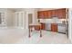 This large kitchen includes a bar area, stainless steel appliances, and custom cabinetry at 164 Arabella Ct, Cary, NC 27518