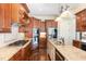 Beautiful kitchen with custom wood cabinetry, granite countertops, and stainless steel appliances at 164 Arabella Ct, Cary, NC 27518