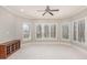 Bright living room with bay window and shutters providing natural light and tree-lined views at 164 Arabella Ct, Cary, NC 27518