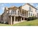 Elegant brick home with multiple decks, walkout basement, and well-manicured lawn, offering seamless indoor-outdoor living at 164 Arabella Ct, Cary, NC 27518