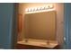 Bathroom vanity featuring double sinks, large mirror, and modern lighting at 1906 Hawfields Crossing Ln, Mebane, NC 27302
