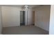 Bright bedroom with neutral carpet, ceiling fan, closet, and access to additional rooms at 1906 Hawfields Crossing Ln, Mebane, NC 27302