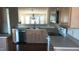 Bright kitchen featuring stainless steel appliances, wood cabinets, and eat-in dining area at 1906 Hawfields Crossing Ln, Mebane, NC 27302