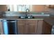 Kitchen with stainless steel dishwasher, sink, and light wood cabinets at 1906 Hawfields Crossing Ln, Mebane, NC 27302