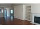 Spacious living room with hardwood floors, fireplace, and ample natural light at 1906 Hawfields Crossing Ln, Mebane, NC 27302