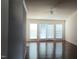 Open living area featuring hardwood floors, ceiling fan and natural lighting at 1906 Hawfields Crossing Ln, Mebane, NC 27302