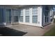 Covered patio with neutral flooring and multiple windows that flood the home with natural light at 1906 Hawfields Crossing Ln, Mebane, NC 27302