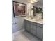 Bathroom vanity with double sinks, artwork, and decorative vase for a modern and stylish appeal at 1913 Fishamble St, Fuquay Varina, NC 27526