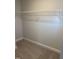 Walk-in closet with neutral carpet and white metal shelving at 1913 Fishamble St, Fuquay Varina, NC 27526