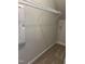 Walk-in closet featuring a white wire shelving system, neutral carpet, and base molding at 1913 Fishamble St, Fuquay Varina, NC 27526