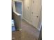 Hallway with neutral carpet, white trim, and doors that lead to other rooms at 1913 Fishamble St, Fuquay Varina, NC 27526