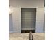 View of a pantry with white wire shelving and dark wood flooring behind a grey granite countertop with sink at 1913 Fishamble St, Fuquay Varina, NC 27526