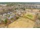 Scenic aerial view of homes backing onto the golf course, complemented by lush landscaping and serene atmosphere at 1928 Jupiter Hills Ct, Raleigh, NC 27604