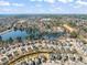 Aerial view showcasing the community's waterfront properties and peaceful lake setting with distant city skyline at 1928 Jupiter Hills Ct, Raleigh, NC 27604