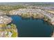 Aerial view of a neighborhood surrounding a lake, showcasing community and landscape at 1928 Jupiter Hills Ct, Raleigh, NC 27604