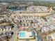 Aerial view highlighting the community amenities including a pool, surrounded by houses and manicured landscapes at 1928 Jupiter Hills Ct, Raleigh, NC 27604