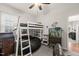 Nicely lit bedroom, ceiling fan and white bunk bed and storage at 1928 Jupiter Hills Ct, Raleigh, NC 27604