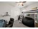 Comfortable bedroom with ceiling fan, closet, and a black bean bag chair at 1928 Jupiter Hills Ct, Raleigh, NC 27604