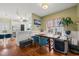 Cozy dining area featuring hardwood floors, built-in bench seating, and an open view of the kitchen at 1928 Jupiter Hills Ct, Raleigh, NC 27604