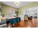 Inviting dining room with hardwood floors, built-in seating, and a view into the living area at 1928 Jupiter Hills Ct, Raleigh, NC 27604