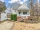 Charming single-story home featuring a covered porch, brick foundation, and mature landscaping at 1928 Jupiter Hills Ct, Raleigh, NC 27604
