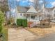 Charming home featuring a covered porch, lush landscaping, and inviting curb appeal at 1928 Jupiter Hills Ct, Raleigh, NC 27604