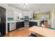 Well-lit kitchen featuring stainless steel appliances, black cabinets, and an eye-catching backsplash at 1928 Jupiter Hills Ct, Raleigh, NC 27604
