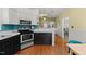 Charming kitchen featuring white cabinets, stainless steel appliances, and modern countertops at 1928 Jupiter Hills Ct, Raleigh, NC 27604