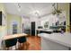 Bright kitchen features stainless steel appliances, white cabinets, and a breakfast nook at 1928 Jupiter Hills Ct, Raleigh, NC 27604
