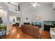 Spacious living room with hardwood floors, a fireplace, high ceilings, and a loft overlook at 1928 Jupiter Hills Ct, Raleigh, NC 27604