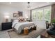 Modern bedroom with neutral tones, accent wall, and ample natural light at 2118 Opulent Oaks Ln # 10, Durham, NC 27713