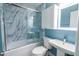 Updated bathroom with modern marble tile shower, new vanity, and lighting at 229 Short St, Wendell, NC 27591