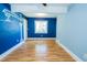 Bedroom featuring bright paint and window offering natural light and exterior views at 229 Short St, Wendell, NC 27591