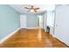 Spacious bedroom with hardwood floors, a desk, and calming green walls at 229 Short St, Wendell, NC 27591