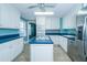 Well-appointed kitchen with custom cabinets, island cooktop, and stainless appliances at 229 Short St, Wendell, NC 27591