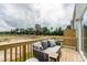 Relaxing outdoor patio with comfortable seating overlooking a landscaped yard at 2323 Bay Minette Sta # 547, Apex, NC 27502