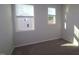 Carpeted bedroom featuring two windows providing natural light at 2323 Bay Minette Sta # 547, Apex, NC 27502