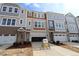 New construction townhome featuring multiple stories, attached garages, and landscaped front yards at 2323 Bay Minette Sta # 547, Apex, NC 27502