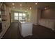 Open kitchen with island, stainless appliances, and pendant lighting at 2323 Bay Minette Sta # 547, Apex, NC 27502