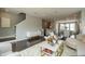 Bright, open-concept living room with hardwood floors and modern decor adjacent to the kitchen and staircase at 2323 Bay Minette Sta # 547, Apex, NC 27502