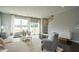 Comfortable living room with large windows, providing an open view of the backyard at 2323 Bay Minette Sta # 547, Apex, NC 27502
