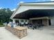 Pool pavilion has an outdoor kitchen with grill and seating area with fireplace for socializing at 2323 Bay Minette Sta # 547, Apex, NC 27502