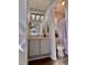 Compact bathroom featuring a vanity with storage and a shower-tub combo with modern fixtures and finishes at 2323 Turtle Point Dr, Raleigh, NC 27604