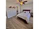 Relaxing bedroom featuring hardwood floors, a ceiling fan, and neutral wall paint at 2323 Turtle Point Dr, Raleigh, NC 27604