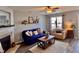 Inviting living room featuring a fireplace, ceiling fan, and a cozy seating arrangement with stylish decor at 2323 Turtle Point Dr, Raleigh, NC 27604
