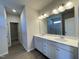 Modern bathroom boasts dual sinks, a large mirror, and a separate shower with glass doors at 253 Deodora Ln, Cameron, NC 28326