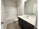 Charming bathroom featuring a tub, shower, spacious vanity and neutral colors at 253 Deodora Ln, Cameron, NC 28326